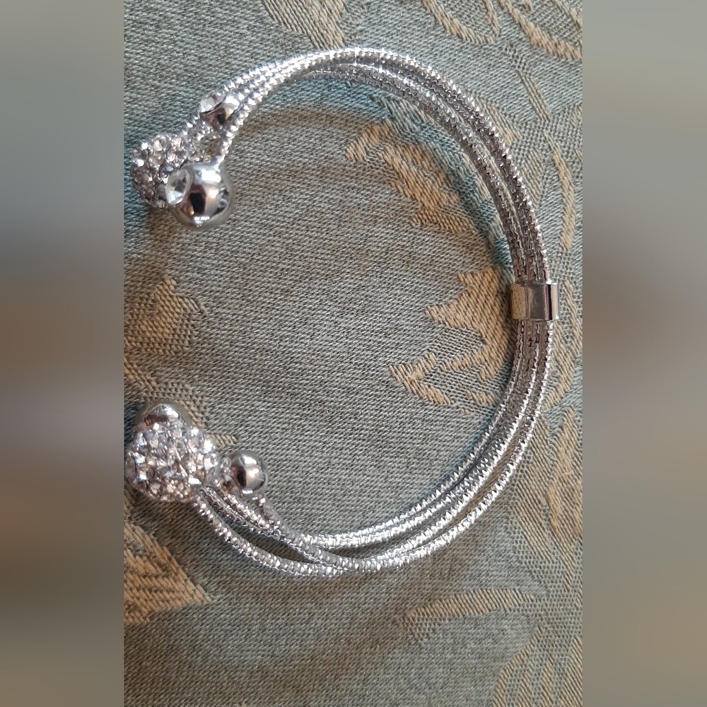 Woman's silver metal cuff bracelet with Rhinestone beads